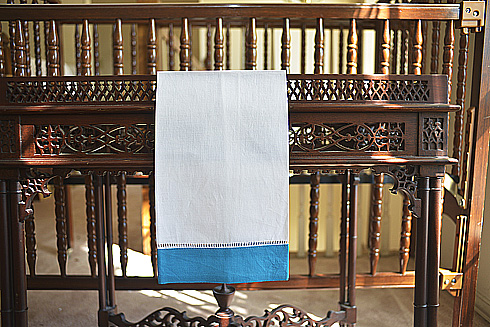 White Hemstitch Guest Towel with Hawaiian Ocean Color Border.